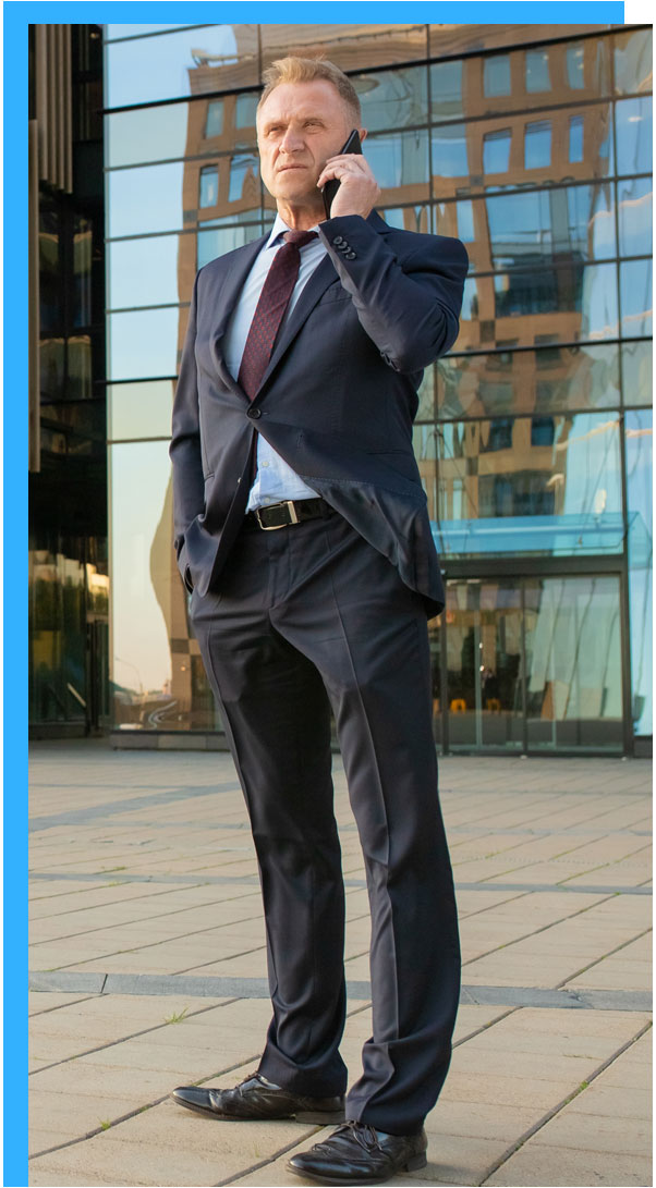 man in suit talking on mobile phone