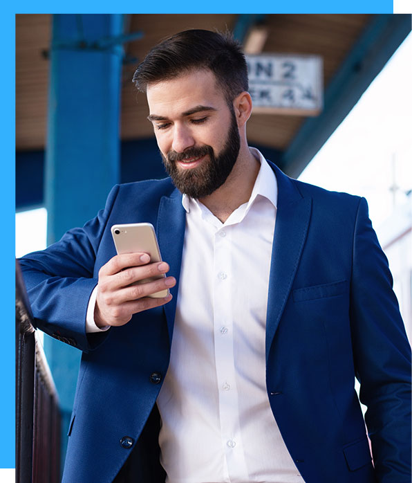 man in suit texting